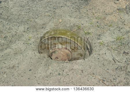Anti-tank mines at sand installing by soldier