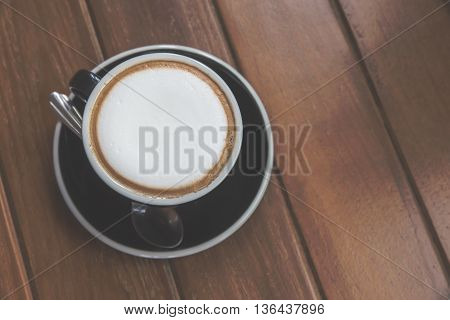 Coffee cup top view on old wooden. Vintage