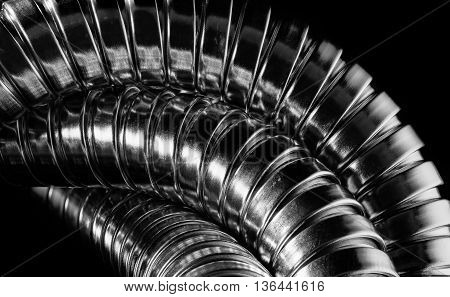 Modern chrome hose isolated/close-up made from metal.