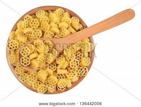 Uncooked Italian Pasta Rotelle In A Wooden Bowl On A White