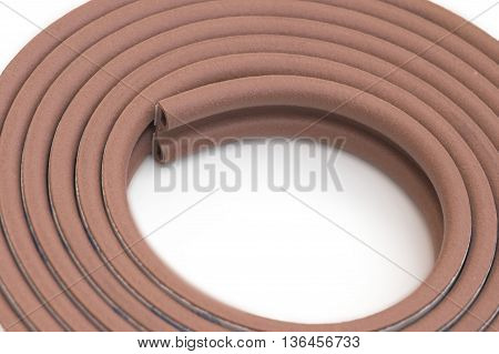 Roll of brown multipurpose sticking bumper over white background