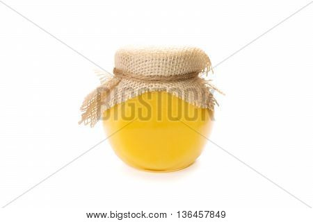 Honey glass jar isolated. Transparent glassy can with natural fresh homemade honey. Honeycomb bank without label.