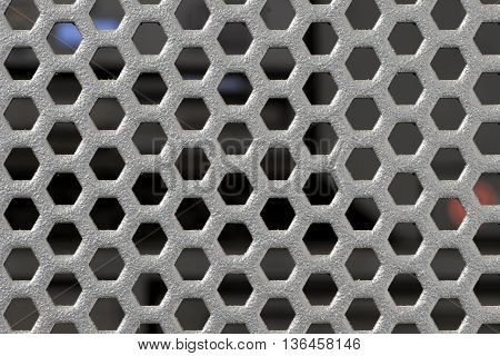 Black round punched mesh of highend server cover with blurry computer server module after lid