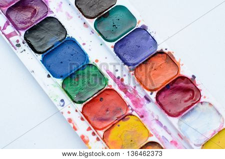 Old and used watercolor paintbox for drawing
