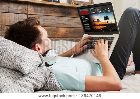 Man watching tv series on a laptop, while lying on the bed. View of laptop screen with streaming service template design.