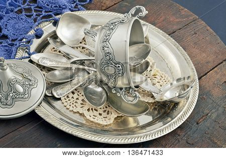 vintage old silverware in a silver tray close-up