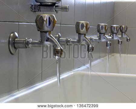 Rows Of Steel Taps In The Bathroom Of Kindergarteners