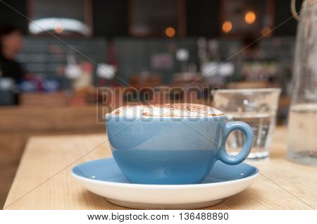 Coffee On A Table In A Busy Cafe