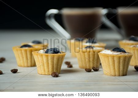 Mini tartlets with white cream and bluberries