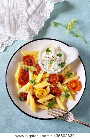 Penne pasta with roasted cherry tomatoes and ricotta sauce