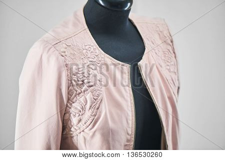 Leather jacket hanging on a mannequin closeup