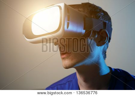 Man wearing virtual reality goggles. Vr glasses concept.
