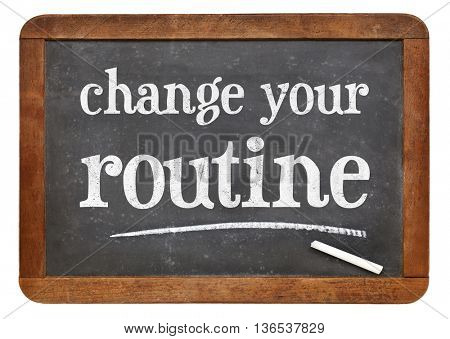 change your routine  - white chalk text on a vintage slate blackboard