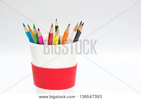 Pencil Crayons in ceramic glass on white backgroundisolated