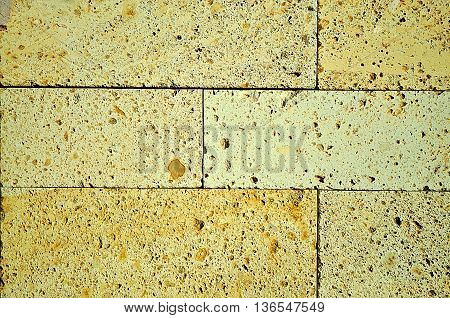 Abstract Yellow brick building wall background texture