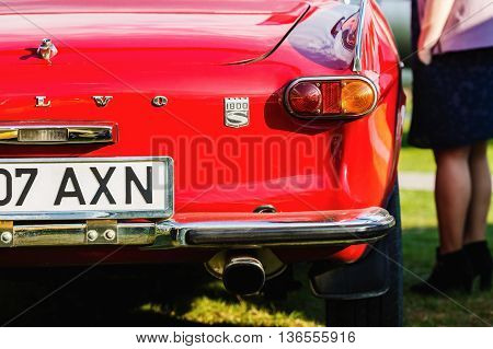 MINSK BELARUS - MAY 07 2016: Close-up photo of red Volvo P1800. Back view of retro classic vintage car. Selective focus.