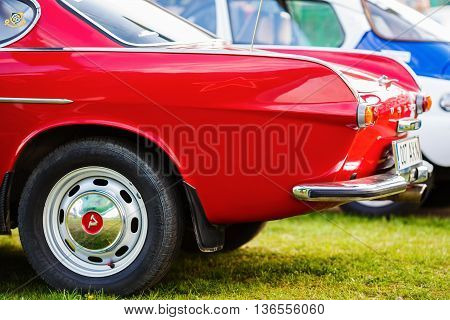 MINSK BELARUS - MAY 07 2016: Close-up photo of red Volvo P1800. Close-up of the rear of vintage car. Selective focus.