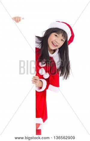 Little asian girl in in Santa Claus uniform with an empty banner isolated on white
