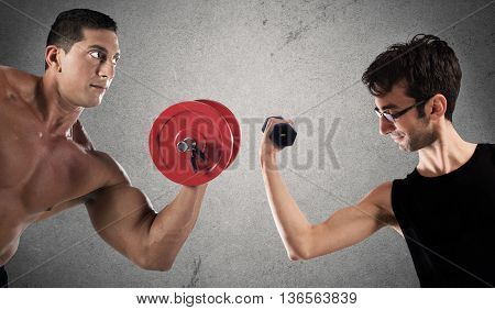 Boys are confronted by lifting a dumbbell weights