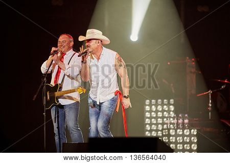 MOSCOW, RUSSIA - APR 24, 2015: Musicians of Secret band M.Leonidov and N.Fomenko in concert during show on stage of Crocus city hall. Rock and roll band Secret founded in 1982 in Leningrad.