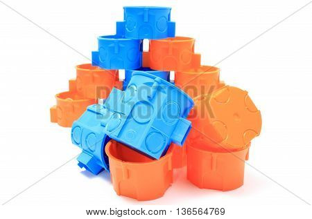Blue And Orange Electrical Boxes On White Background