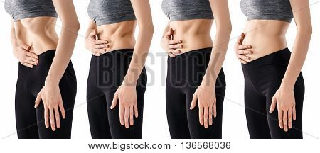 Sporty beautiful young woman practicing Uddiyana Bandha technique on the white background