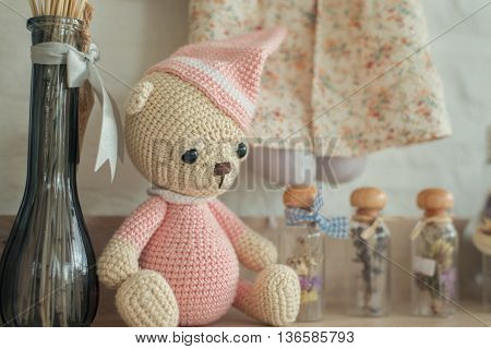 Vintage background with collection of antique childhood treasures on rustic old steamer trunk. Fades into white background for copy space.