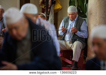 Mangalia Romania - May 27 2016: Muslims hold their Friday prayer at the mosque in Mangalia Romania.
