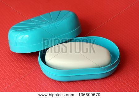 Aroma soap in a blue soap dish