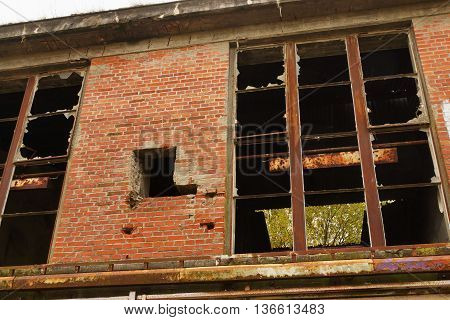 Destroyed window at an old abandoned building