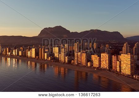 Aerial view of a Benidorm city coastline at sunset. Benidorm is a modern resort city one of the most popular travel destinations in Spain. Costa Blanca Alicante province