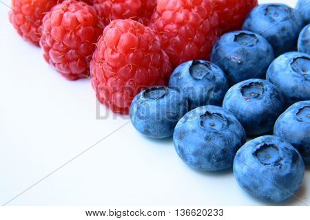 Closeup Of A Bunch Of Raspberries And Blueberries
