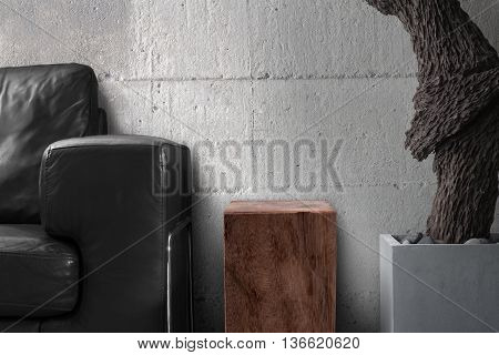 black sofa wooden table with root sculpture hard concrete wall in gray living room