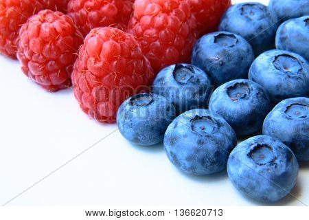 Closeup Of A Bunch Of Raspberries And Blueberries