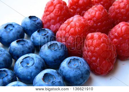 Closeup Of A Bunch Of Raspberries And Blueberries