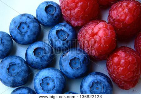 Closeup Of A Bunch Of Raspberries And Blueberries