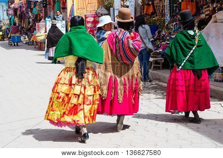 Copacabana Bolivia-March 23 2015:Bolivian women in traditional clothes on the street Copacabana.