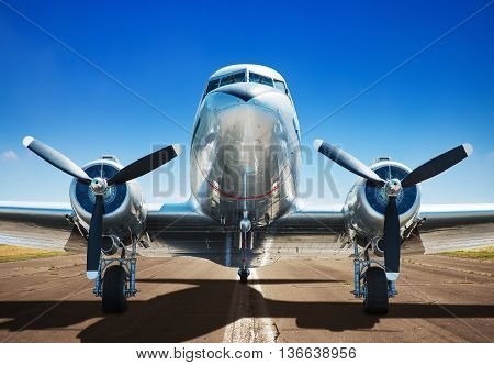 old airplane on a runway ready for take off
