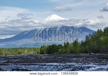 Beautiful summer volcanic landscape of Kamchatka Peninsula: view on Ostry Tolbachik Volcano on a sunny day. Eurasia Russian Far East Kamchatsky Region Klyuchevskaya Group of Volcanoes.
