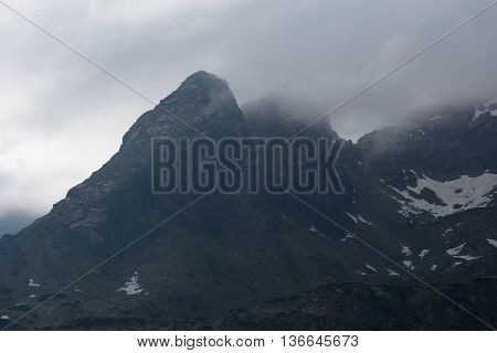Koscielec peak in clouds in Tatra mountains nearby Zakopane in Poland