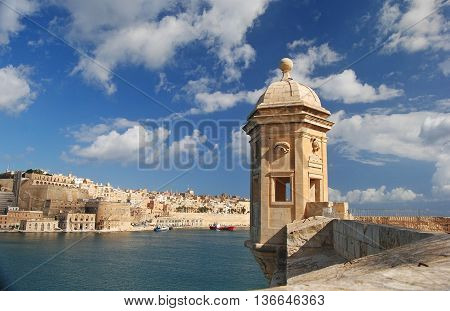 A little watchtower in Senglea with Valletta in the background, Malta.
