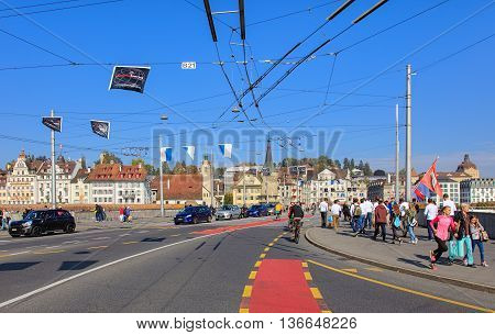 Lucerne, Switzerland - 3 October, 2015: pedestrians and traffic on the Seebruecke bridge. The Seebruecke bridge connects the historical and contemporary parts of the city of Lucerne. Lucerne is a city in central Switzerland.