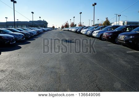 NAPERVILLE, ILLINOIS / UNITED STATES - NOVEMBER 3, 2015: Rows of brand new luxury vehicles are available for purchase on the lot at Lexus of Naperville.