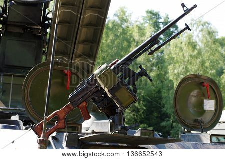 Light machine-gun armored vehicle weaponry military theme.