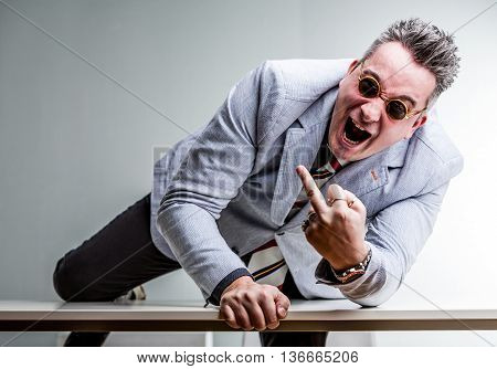Angry Crazy Businessman Showing Middle Finger