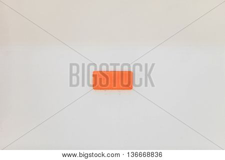 Retroreflector on white background. Small reflecting light cataphote.