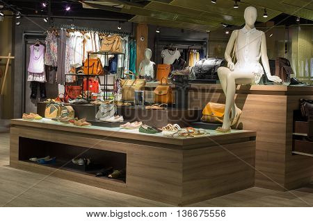 BANGKOKTHAILAND - NOVEMBER 19 2013 : Women's clothing section in supermarket Siam Paragon. Siam Paragon is a one of the biggest shopping centres in Asia.