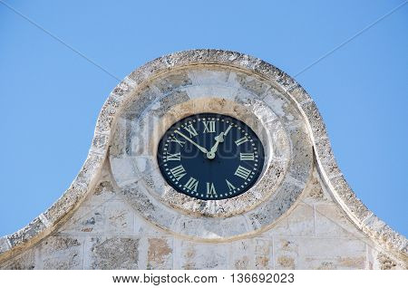 FREMANTLE,WA,AUSTRALIA-JUNE 1,2016:  Fremantle Prison clock detail under a clear blue sky in Fremantle, Western Australia.