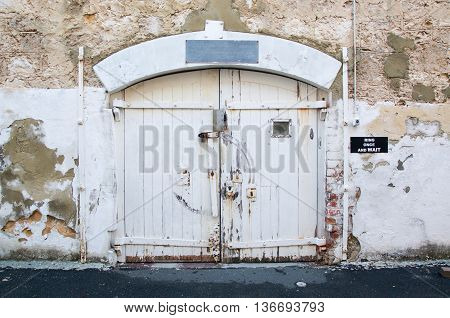 FREMANTLE,WA,AUSTRALIA-JUNE 13,2016: Weathered exterior wall doors at the Fremantle Prison in Fremantle, Western Australia.