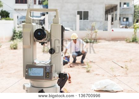 Man survey checking before housing construction site